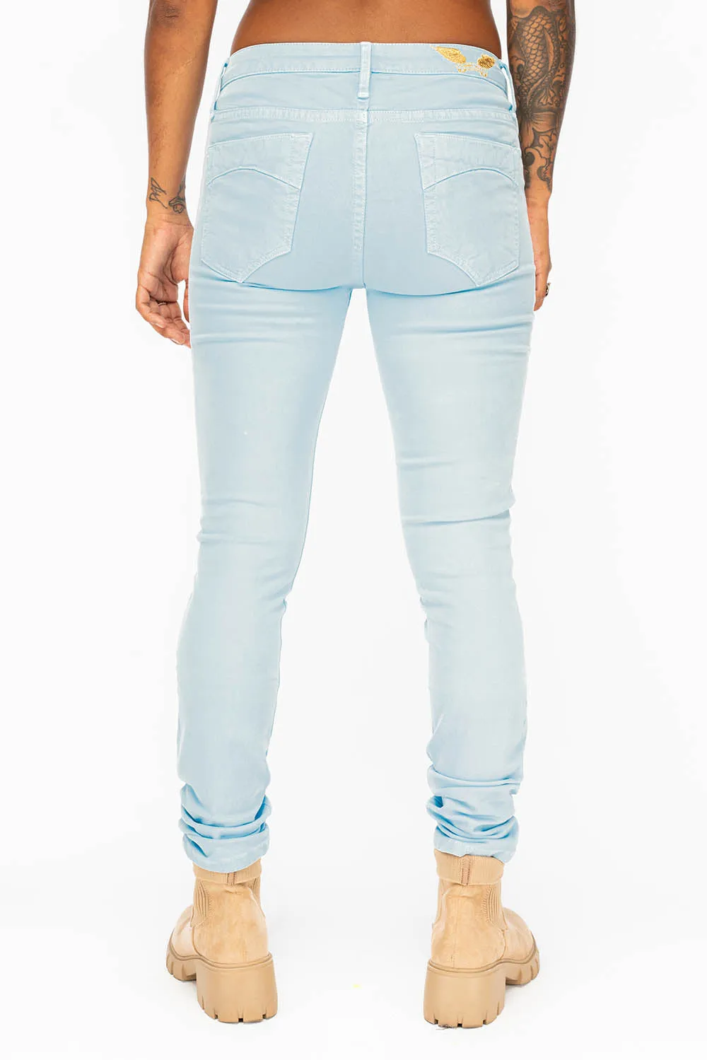 MID RISE WOMENS SKINNY JEANS IN PASTEL BLUE WASH